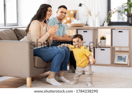 Similar – Image, Stock Photo Mother and toddler with mobile phone in hand