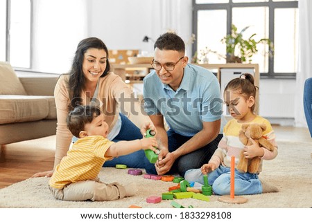 Image, Stock Photo Mother and baby playing around the Christmas Tree