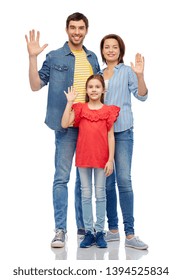 Family And People Concept - Happy Smiling Mother, Father And Little Daughter Waving Hand Over White Background