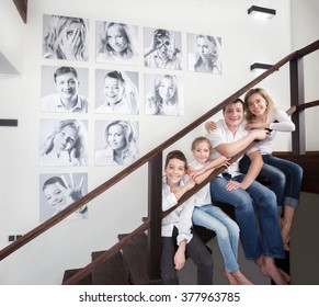 Family Photos On The Wall. Portraits Of Family Stairwell