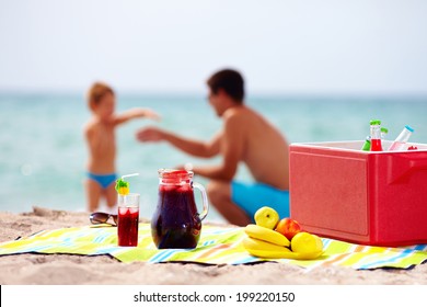 Family Picnic On The Beach