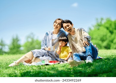 family picnicking in the park - Powered by Shutterstock