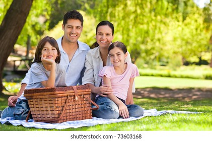 Family picnicking in the park - Powered by Shutterstock