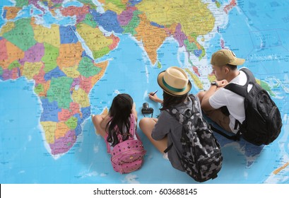 The Family Is Planning A Trip Around The World.They're Looking At A World Map