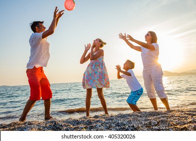 Family play on beach