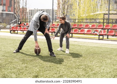Family Playing American Football Together In Park. - Powered by Shutterstock