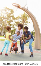 Family Playing Basketball Together