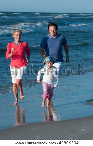 Similar – Little girl running with women on beach