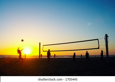 Family Playing Beach Volleyball