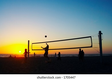 Family Playing Beach Volleyball