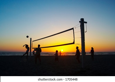 Family Playing Beach Volleyball