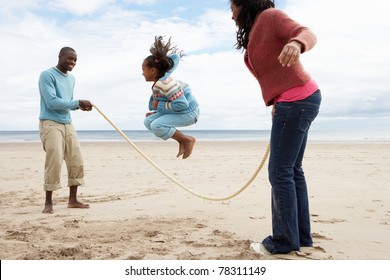 Family playing on beach