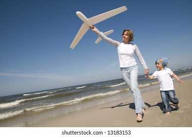 Family playing with plane model - Powered by Shutterstock