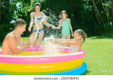 Family playing together in backyard