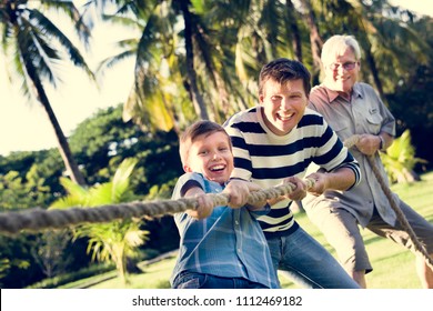 Family Playing Tug Of War