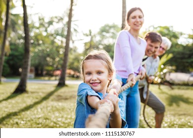 Family Playing Tug Of War