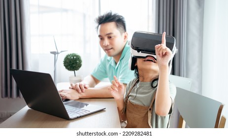 Family Playing Video Games With VR Glasses.Child With Virtual Reality Headset At Home