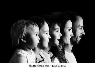 Family Portrait Of Father, Mother And Three Boys, Profile Picture Of Them All In A Row, Isolated On Black Background, Monochrome Version