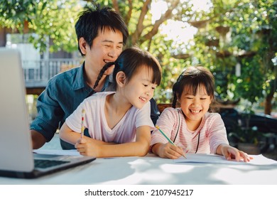 Family portrait of father and preschool daughter use computer for study at home. Dad teach his children to do homework via online classroom. Concept for work at home during covid-19 quarantine. - Powered by Shutterstock