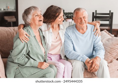 Family portrait happy beautiful faces, adult daughter embracing 60s father middle-aged mother closest relatives people, good relations concept. Dad, mom and adult daughter at home - Powered by Shutterstock