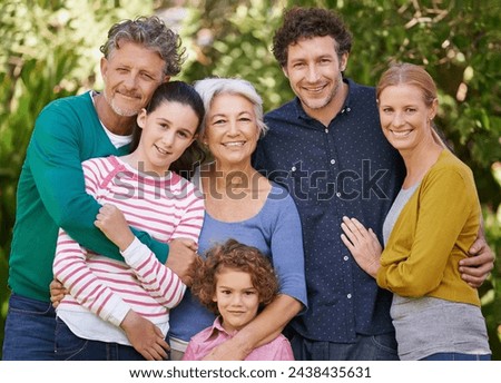 Family, portrait and hug in outdoor garden, love and bonding together or happy in backyard. Generations, smile and peace or embrace for support in nature or kids, vacation and holiday in France