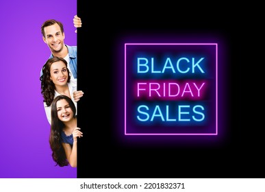 Family Portrait Image - Smiling Father Mother And Little Daughter Peek Out From Behind Big Board Isolated On Violet Purple Background. Paper Broadsheet With Black Friday Sales Text Sign. Advertisement