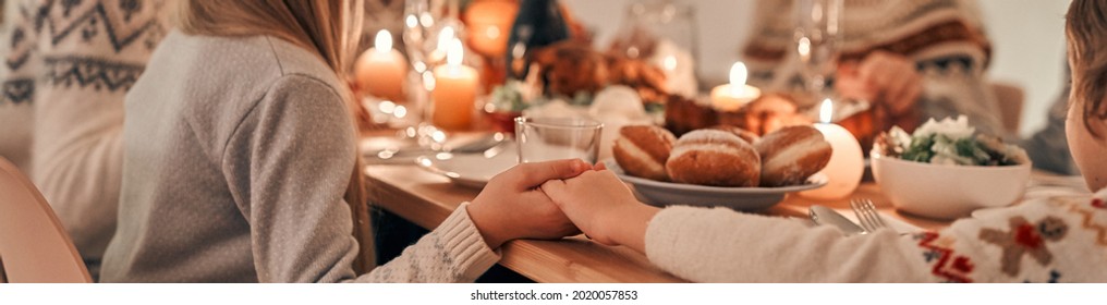 The Family Praying At The Christmas Table