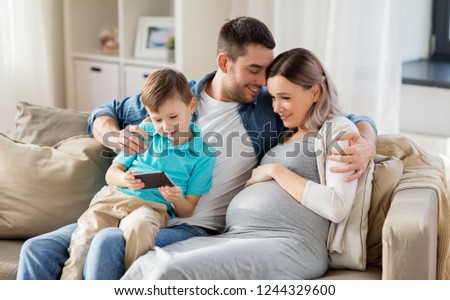 Similar – Image, Stock Photo Pregnant woman and little daughter in the rustic kitchen