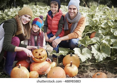 Family Preparing For Halloween Par