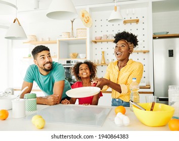 Family preparing pancakes in the kitchen at home - Powered by Shutterstock