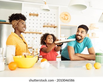 Family preparing pancakes in the kitchen at home - Powered by Shutterstock