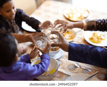 Family raising toast at Diwali dinner - Powered by Shutterstock