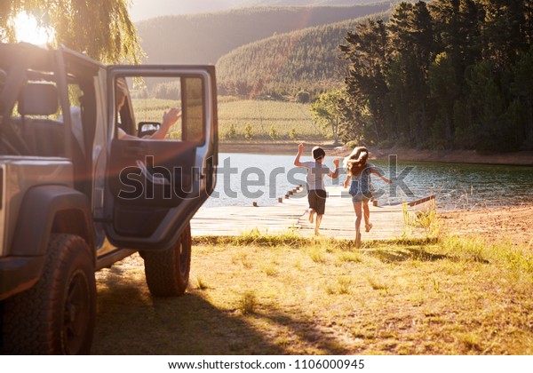 Family
Reaching Destination By Lake After Road
Trip