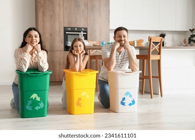 Family with recycle trash bins in kitchen - Powered by Shutterstock