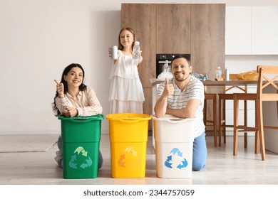 Family with recycle trash bins in kitchen - Powered by Shutterstock