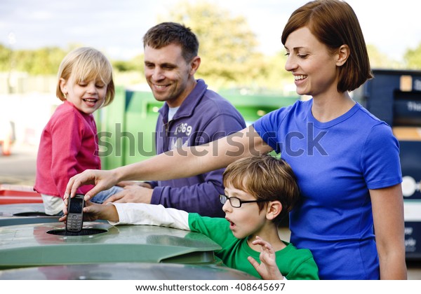 A family recycling a\
mobile phone