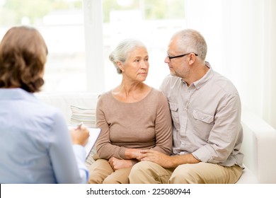 Family, Relations, Age And People Concept - Senior Couple And Psychologist Or Social Worker At Home