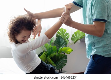 Family Or Relationship Violence Concept. Man Jerking To Caucasian Woman Victim's Hand. Physical, Emotional,sexual And Psychological Abuse Caused Of Trauma,suffer,bodily And Mental Injuries.