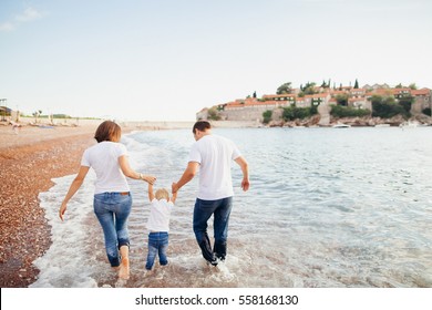 Family Relax On Beach. Family Travel Sea Side.