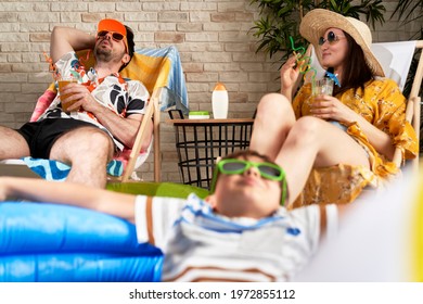 Family relaxes while on vacation at home - Shutterstock ID 1972855112