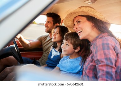 Family Relaxing In Car During Road Trip