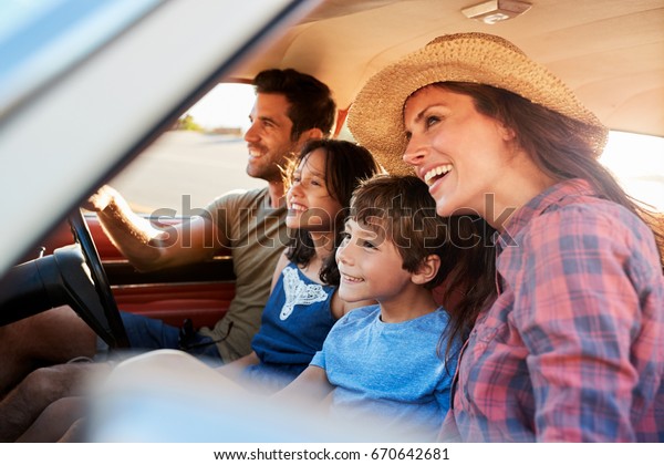 Family Relaxing In Car\
During Road Trip