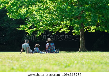Family relaxing in lawn