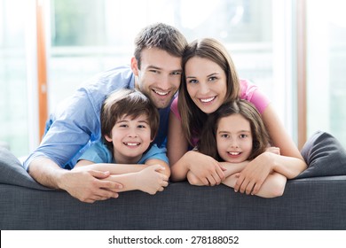 Family relaxing on sofa - Powered by Shutterstock