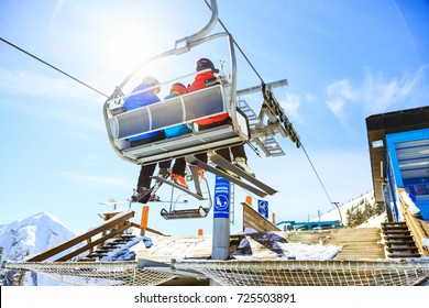 Family Riding In The Ski Lift