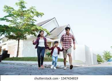 Family Running Around Together While Playing And Have Fun At Home