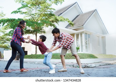 Family Running Around Together While Playing And Have Fun At Home