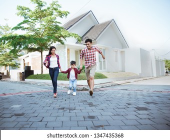 Family Running Around Together While Playing And Have Fun At Home