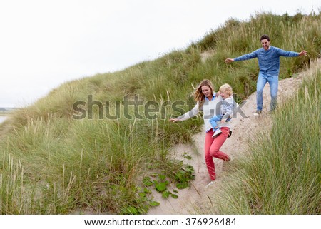 Similar – Image, Stock Photo Young couple taking a walk near the coast