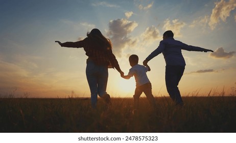 Family is running and throwing a child. happy family kid dream concept. Silhouette of a family running in the park. Silhouette of a family running together in the lifestyle park throwing. - Powered by Shutterstock